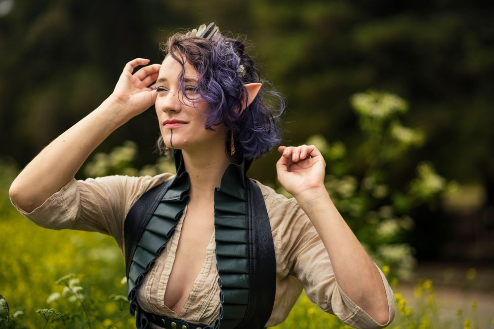 Fantasy shoot of a female model with elf ears, wearing a quartz crown and flowy clothing, with Ren Faire-inspired spring vibes