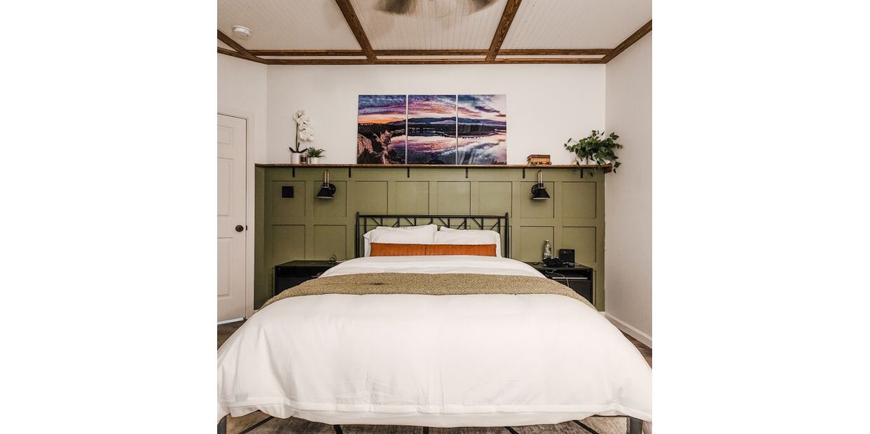 A 3 (three) panel print fine art print of the Flathead Lake displayed in a bedroom