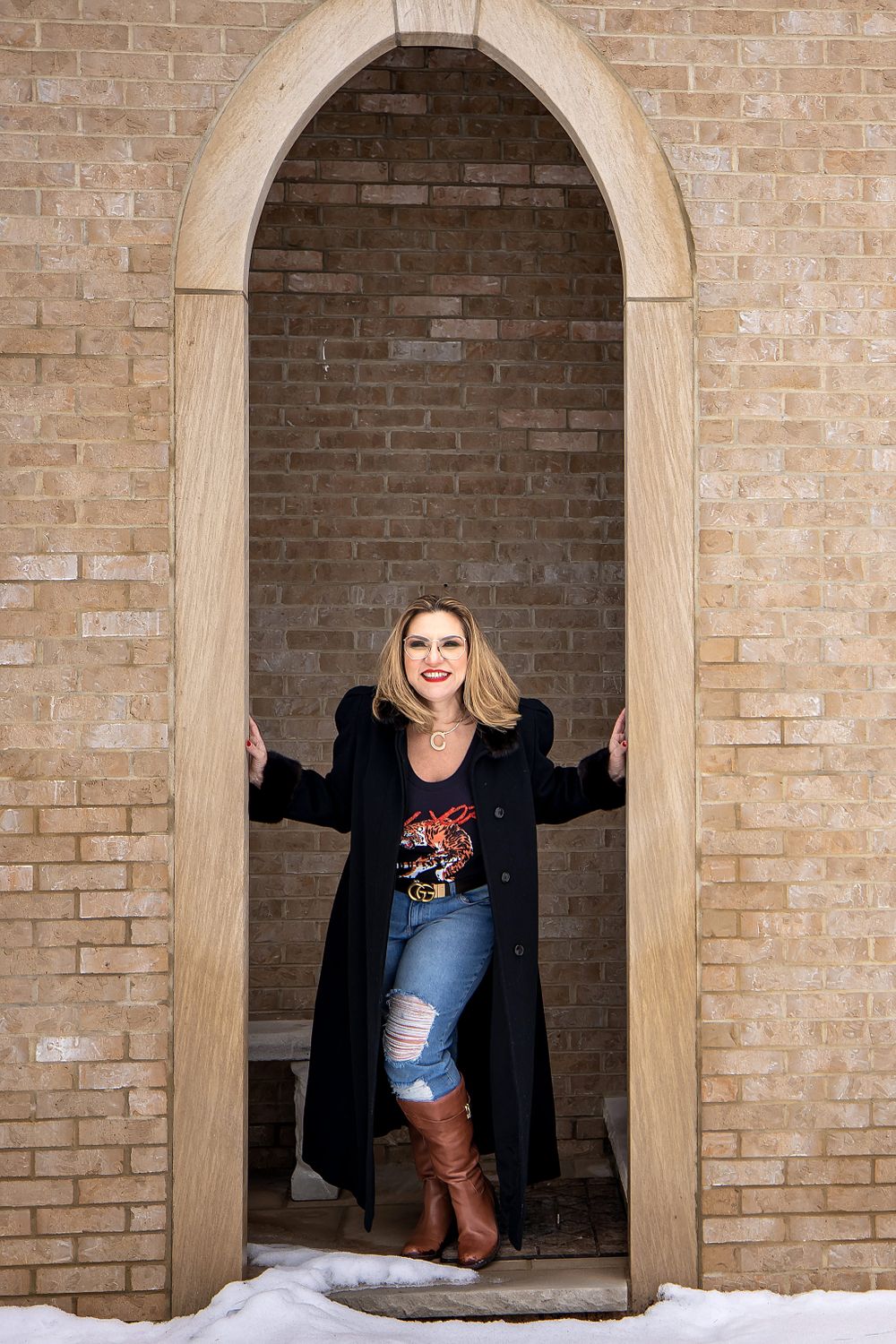 Series of playful poses in brick archways showing joyful moments and casual style.