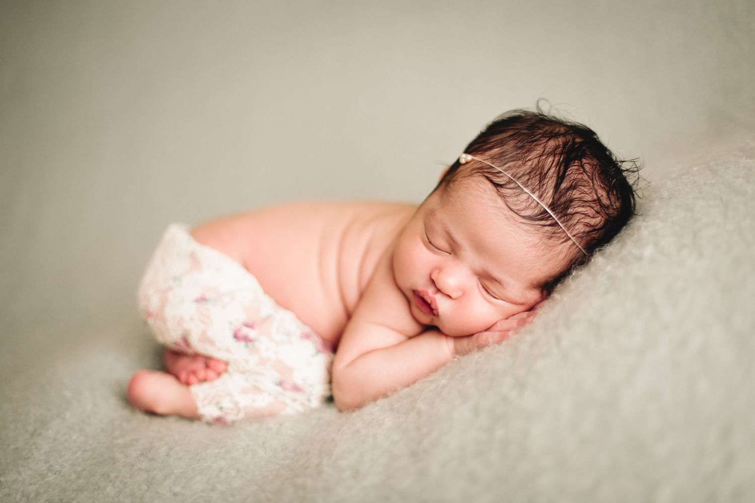 baby girl posed for newborn studio photo shoot in blue springs missouri
