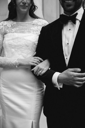 Black and white wedding photos showing couples in formal attire with brides in white dresses and grooms in tuxedos.