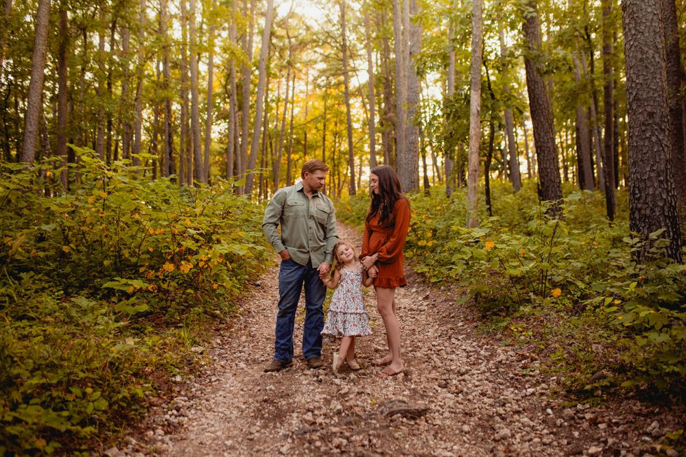 Family enjoying quality time together in the peaceful pine trees of Mark Twain National Forest, Ava, Missouri, capturing nature’s serenity.