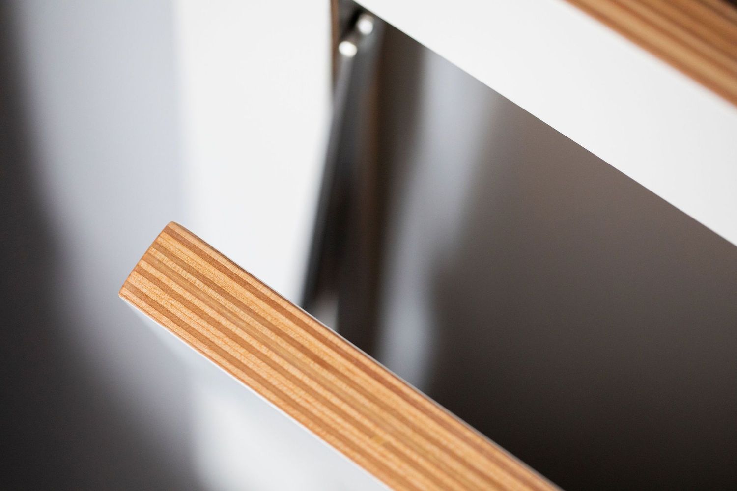 Close-up detail of wooden edge trim showing precise craftsmanship.