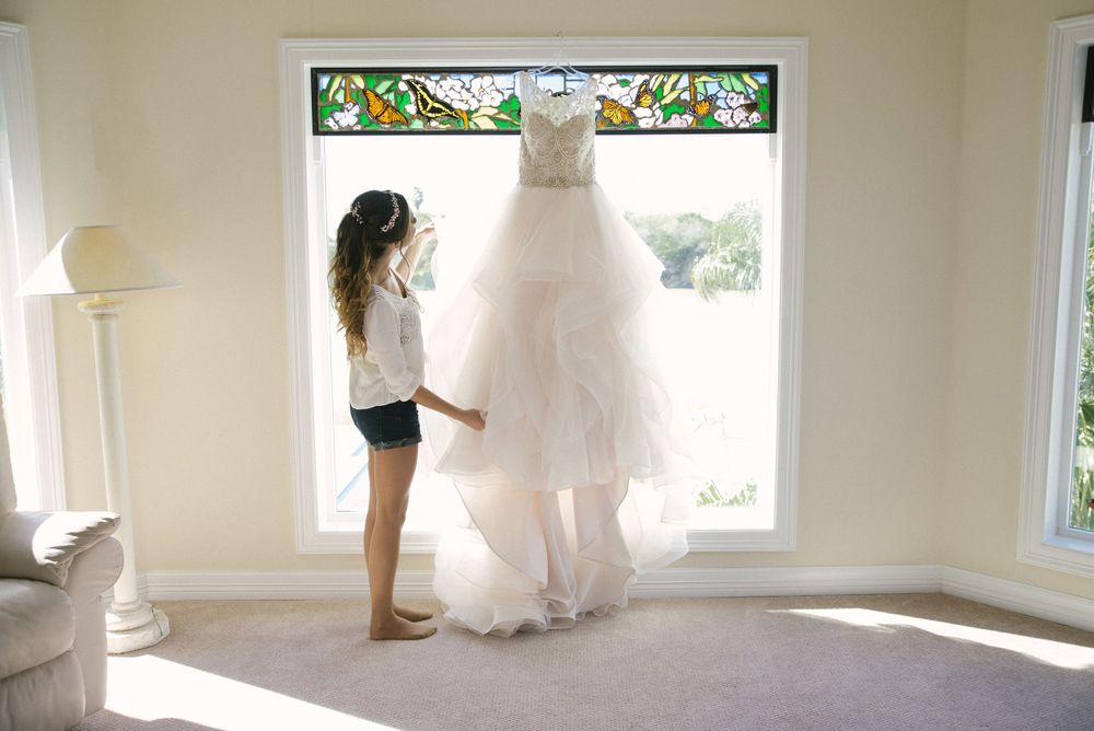 bride looking at her wedding dress. wedding day. Progreso Texas. wedding photographer