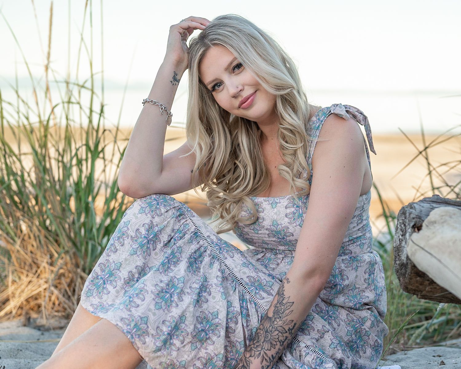 Stunning blond poses at the beach.