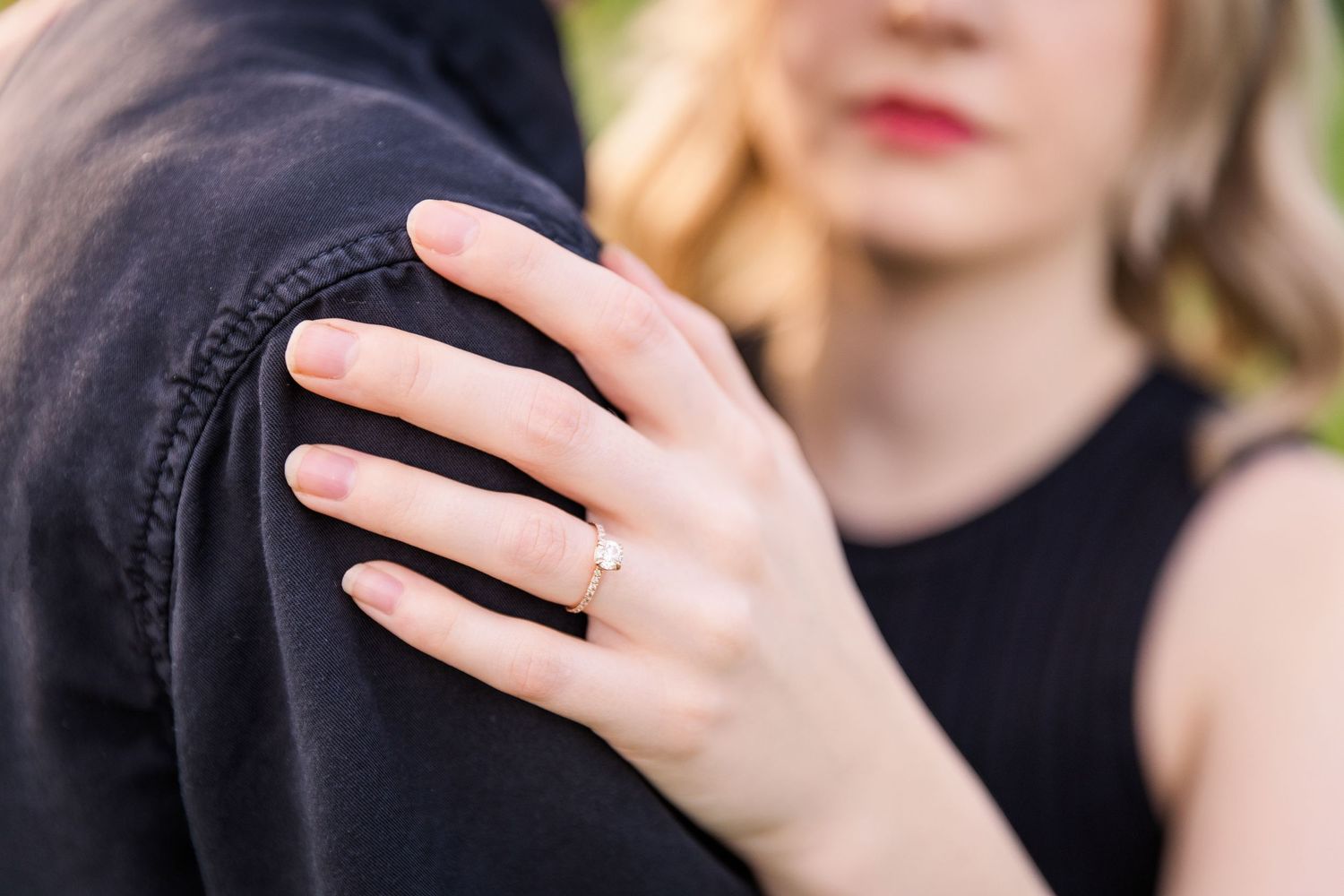 engagement ring hang holding shoulder