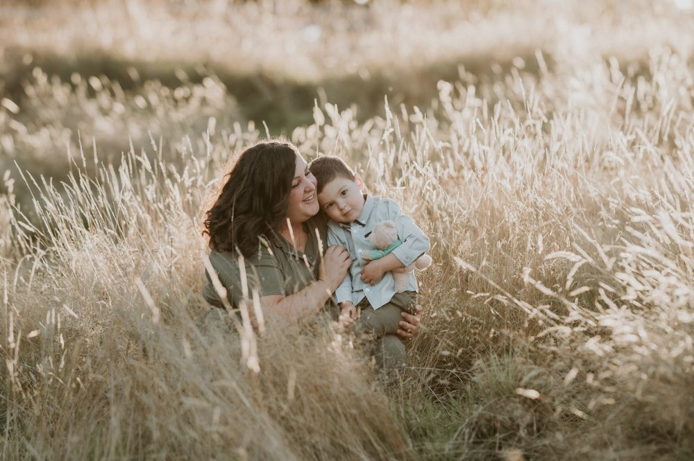 mother and son in a tassie field by tasmanian family photographer joss jensen