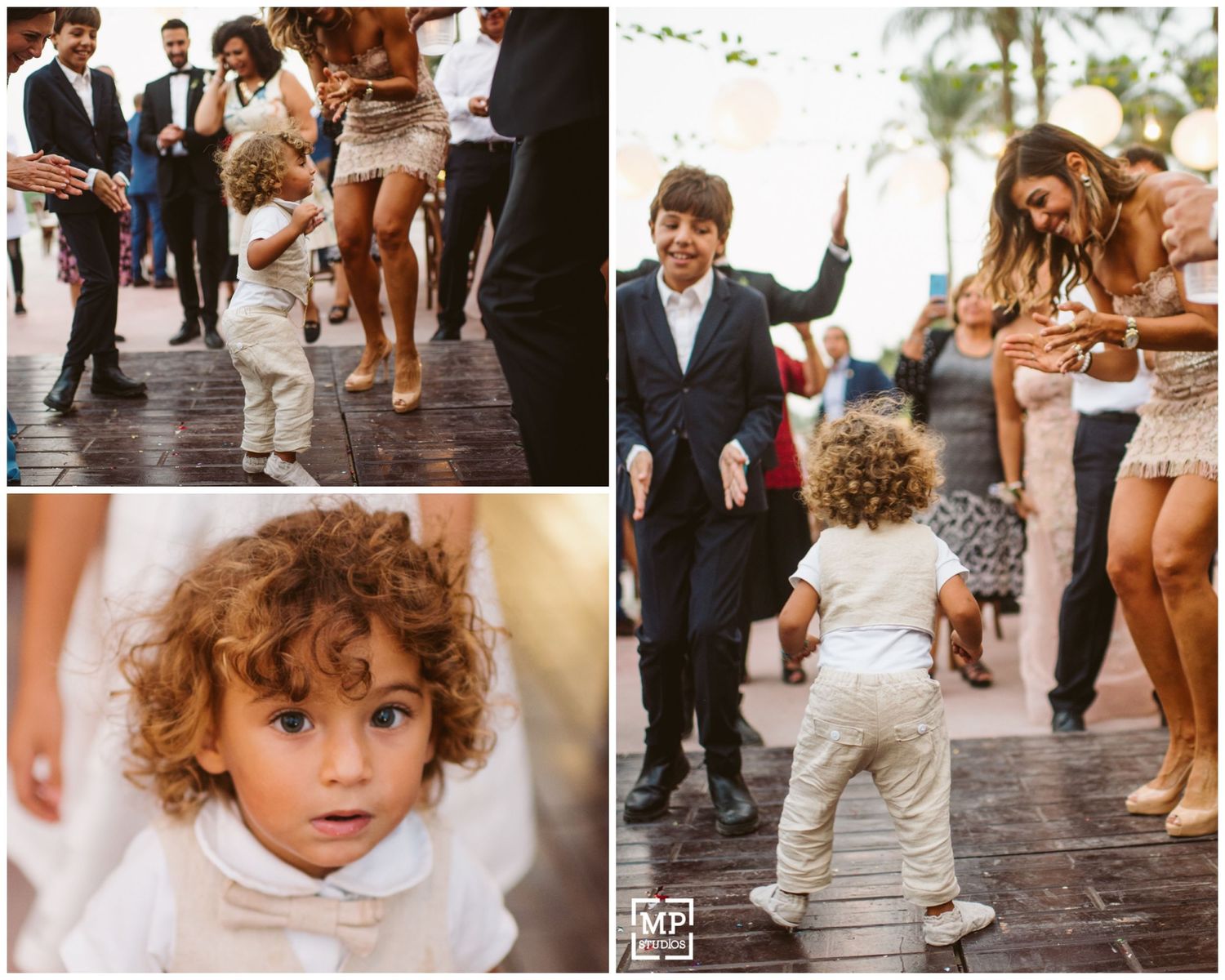Young children in formal attire dancing and having fun at an outdoor wedding reception.