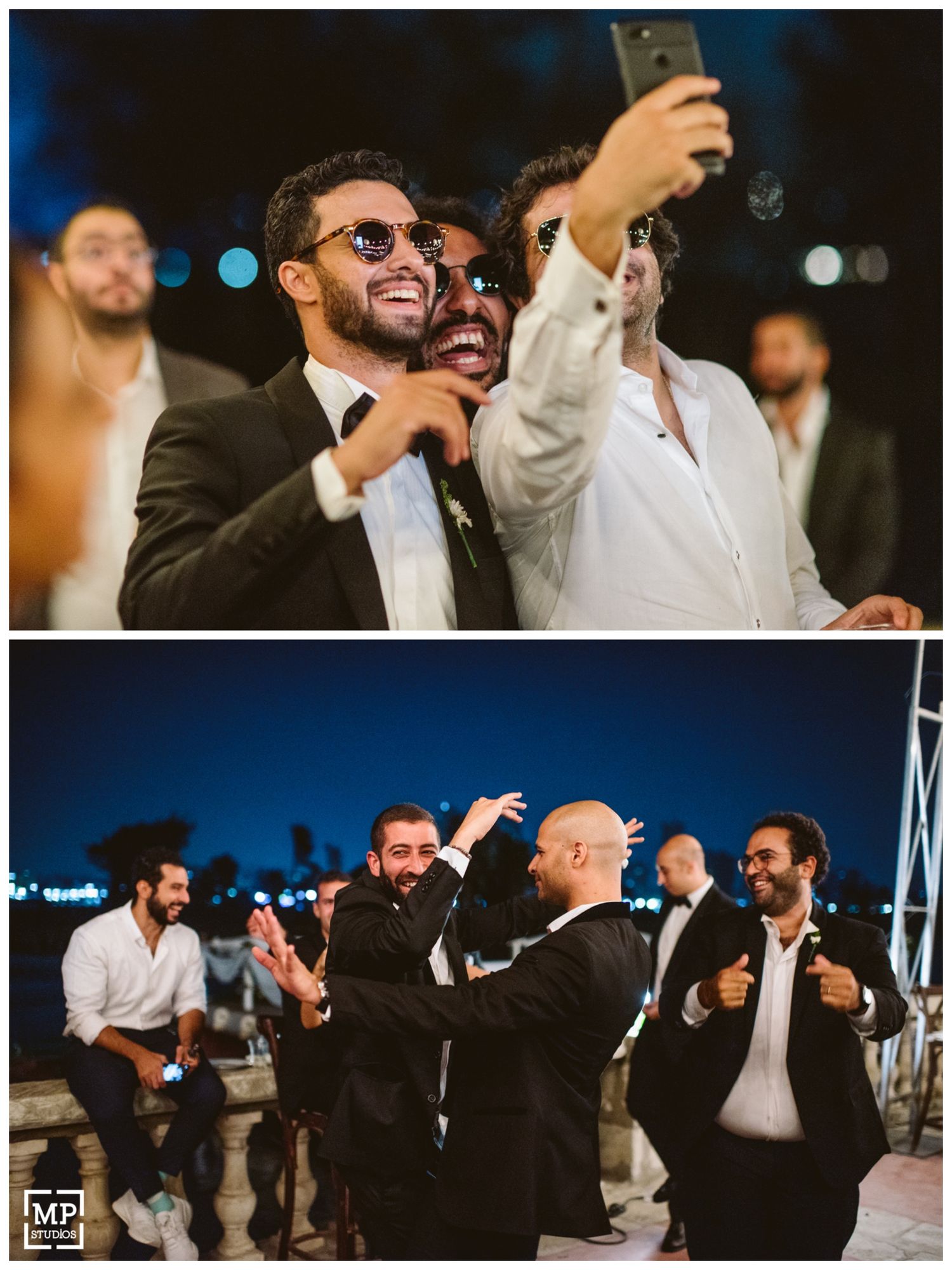 Wedding guests taking selfies and celebrating during an outdoor evening reception.
