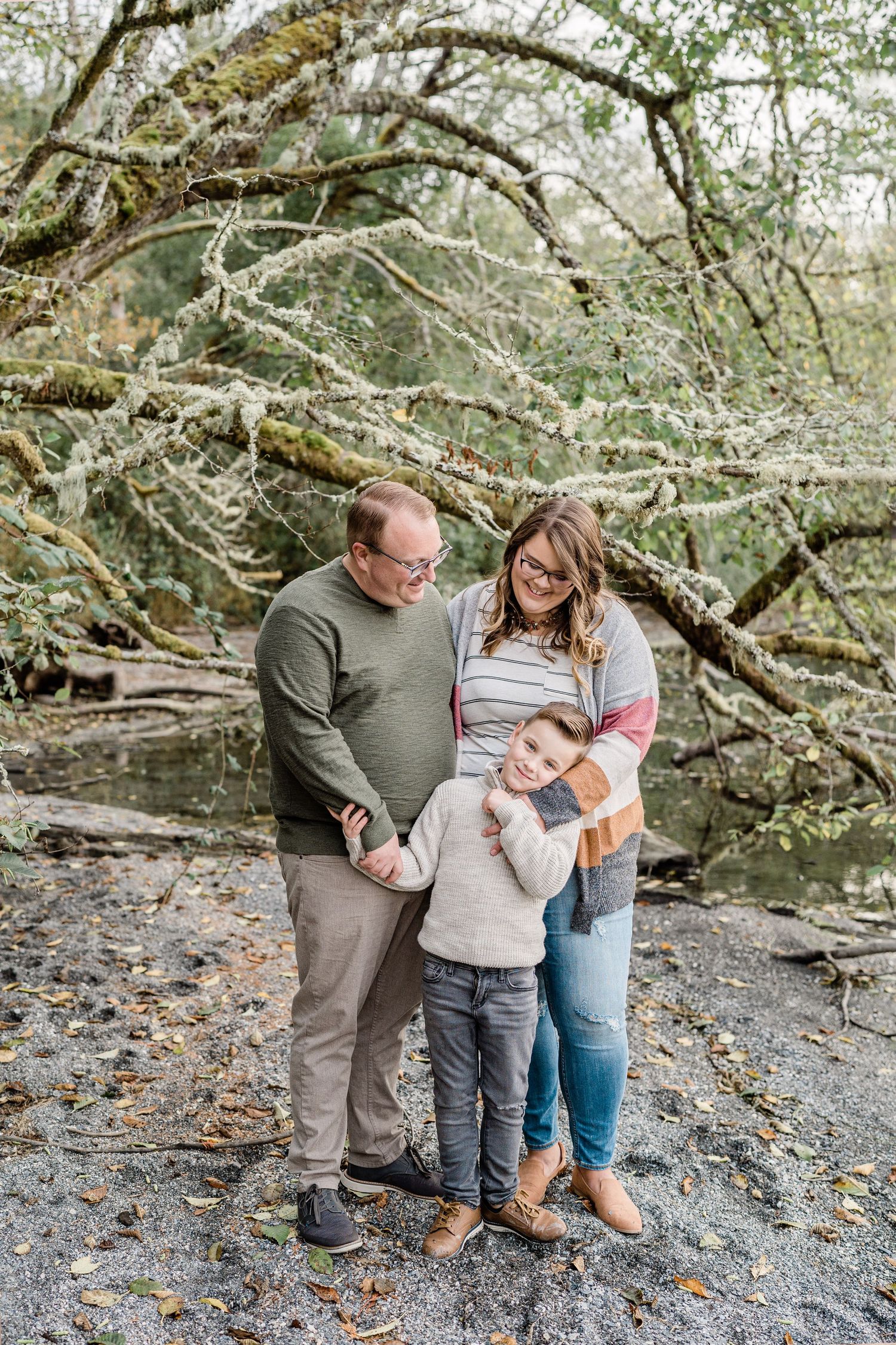 lifestyle family photo at lake whatcom in bellingham washington parents love on their son candid pictures lifestyle photographer
