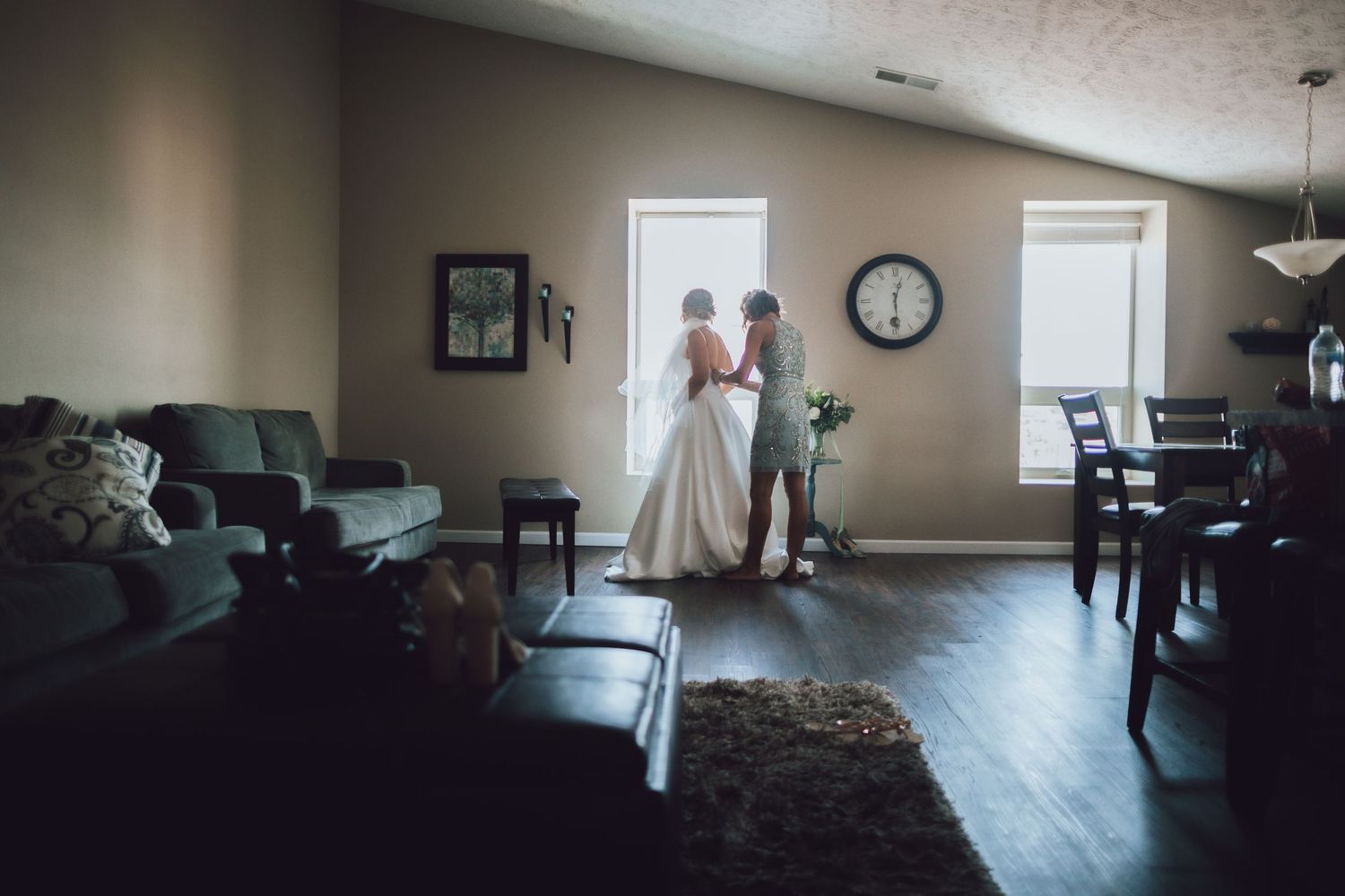 A panoramic view of an empty room with natural light streaming through windows.