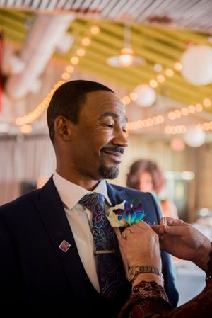 groom getting ready for beach wedding on Panama City Beach Florida