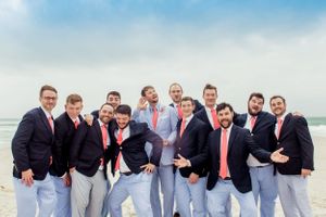 groomsmen acting silly on his beach wedding day at sunset on Panama City Beach Florida