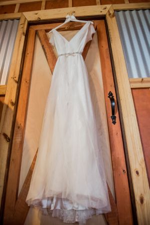 wedding dress hanging in barn in Panama City Florida
