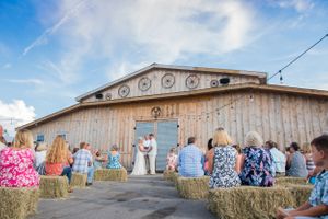 wedding ceremony in front of barn in Panama City Florida