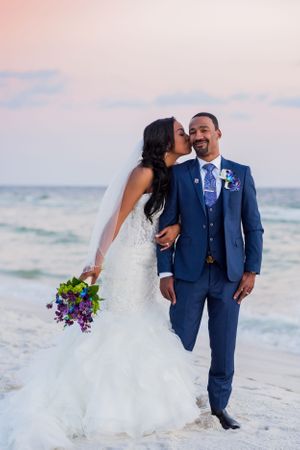 bride kissing groom after their beach wedding on Panama City Beach Florida Hcbeachphotography