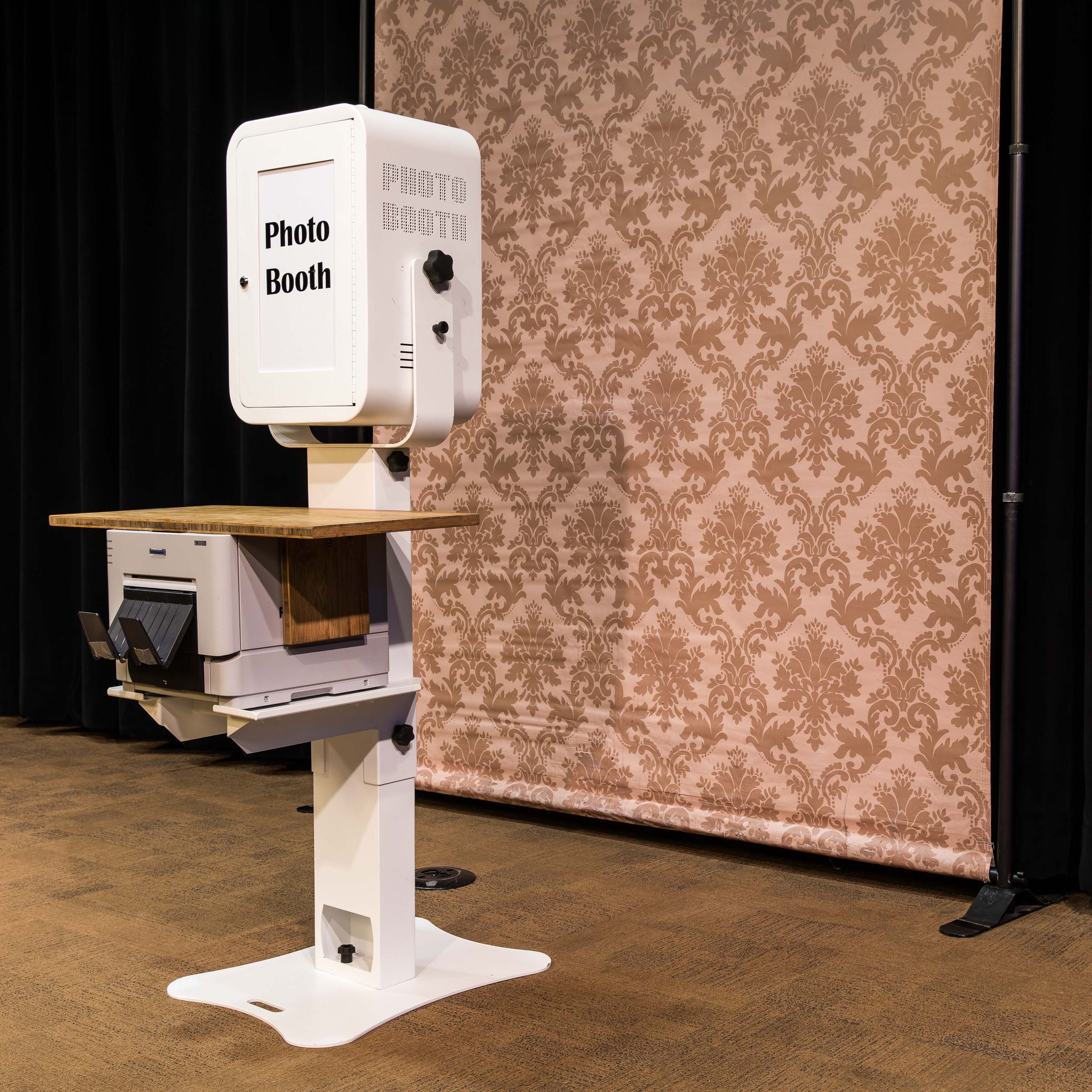 Overview of the photo booth with the damask pattern background that suits many of Telluride's old western decor