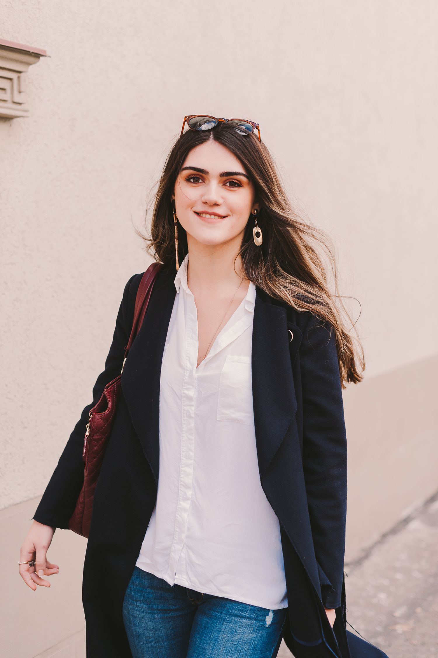 Professional fashion portraits showing classic business casual style with blazer and white shirt.