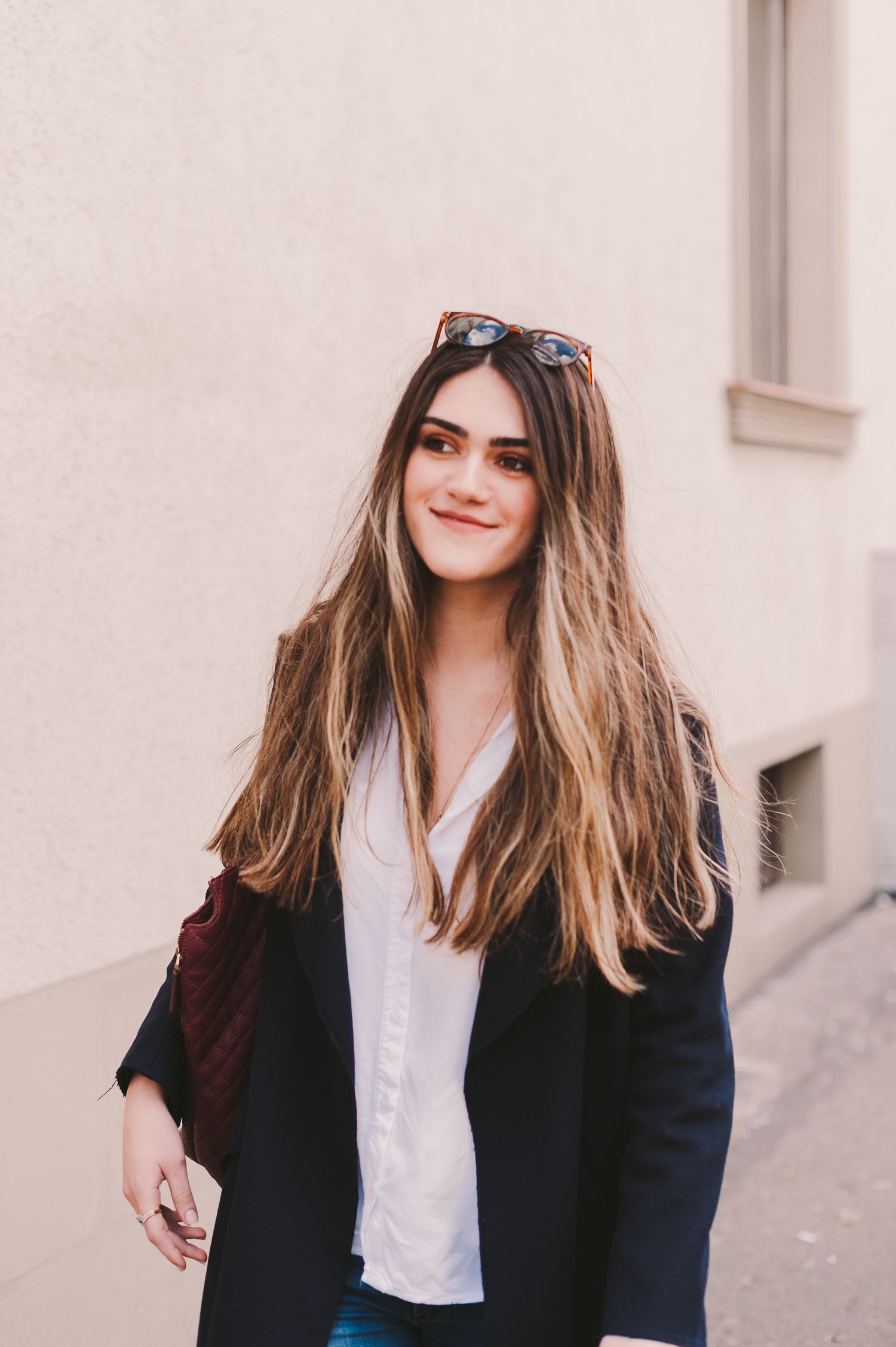 Lifestyle portraits showing confident poses in business casual attire against neutral background.