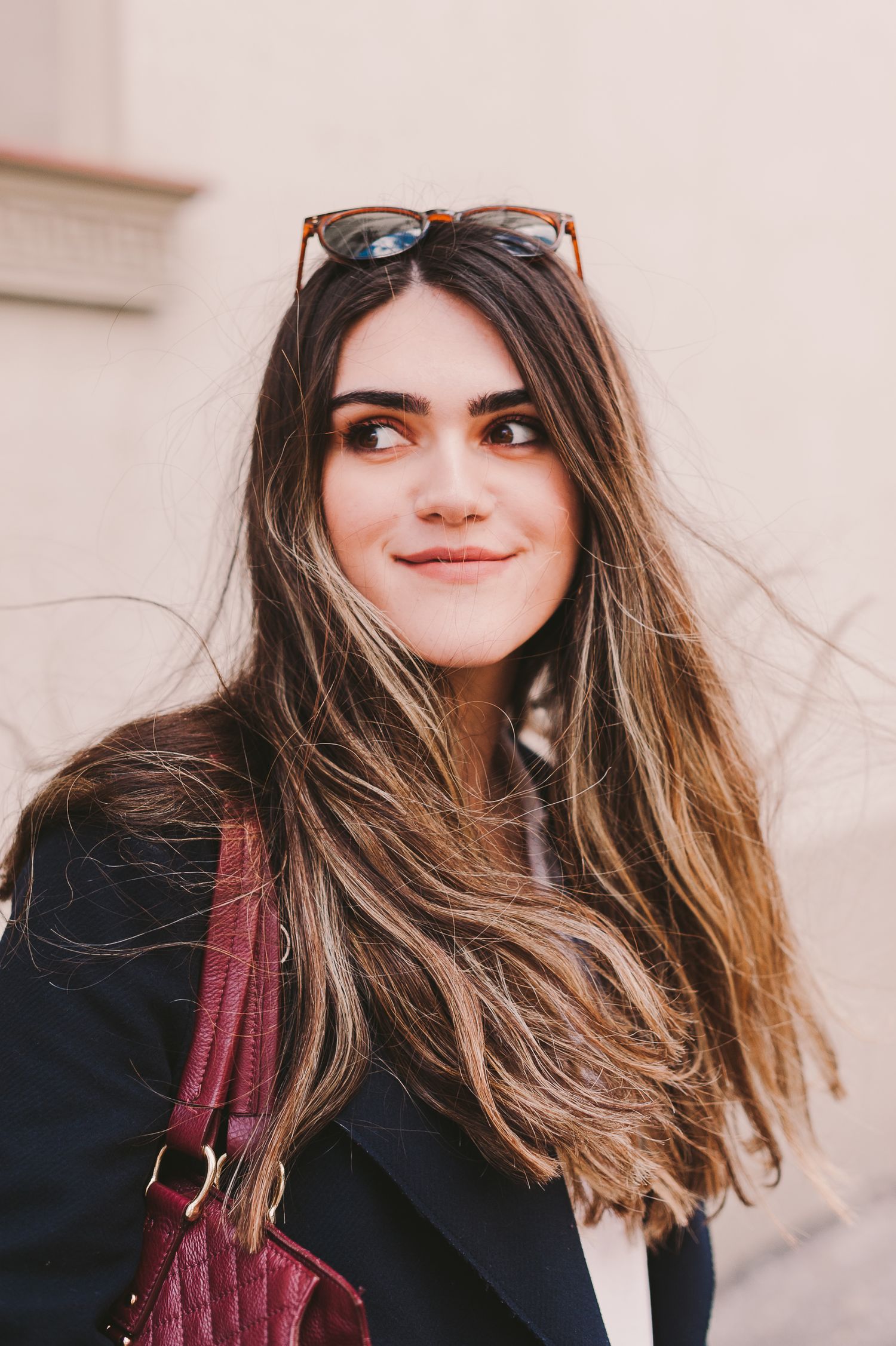 Candid fashion portraits featuring long hair, sunglasses and burgundy accessories.