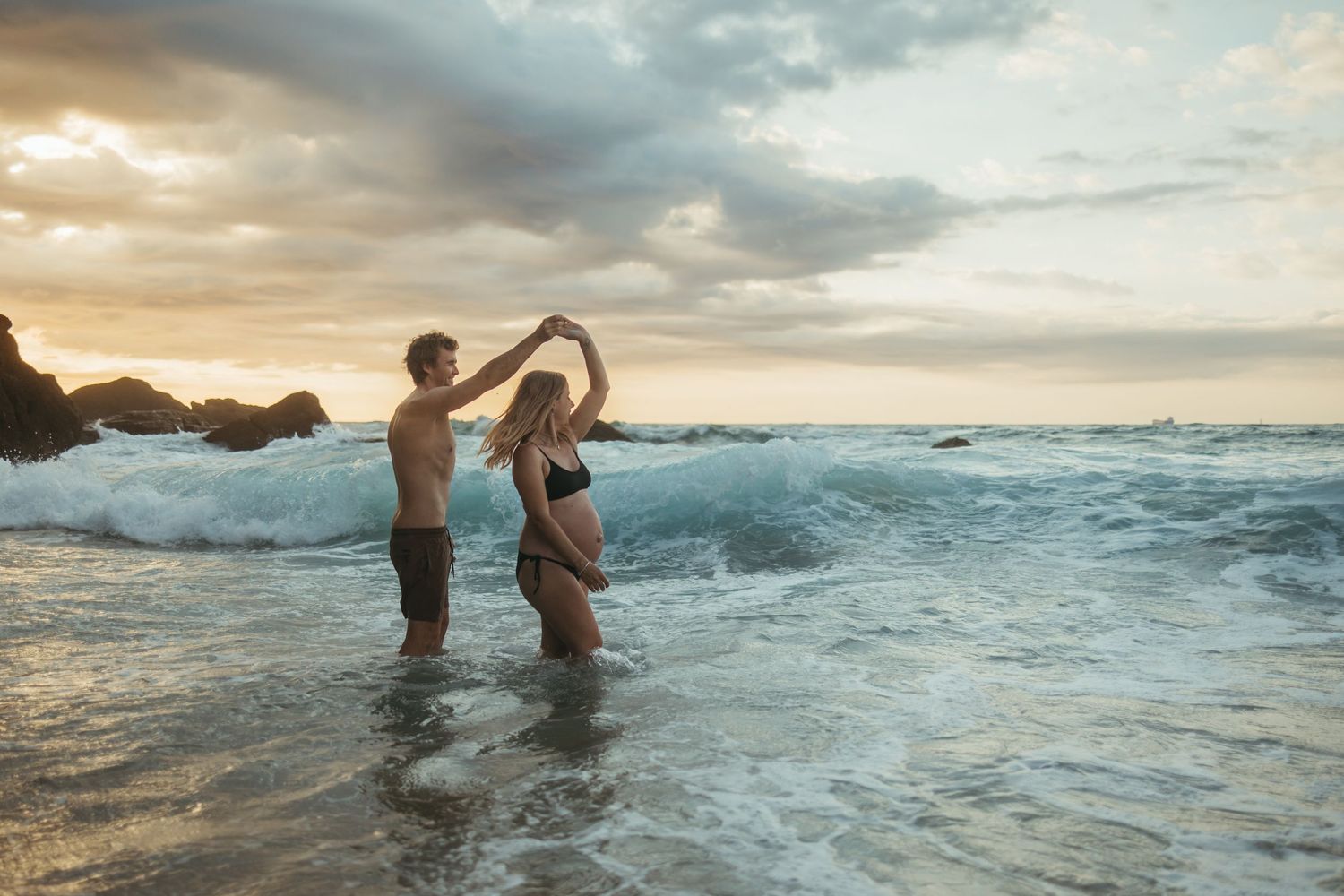Woman Man pregnant couple family Maternity Photoshoot at sunset on the beach, Lake Macquarie, Newcastle