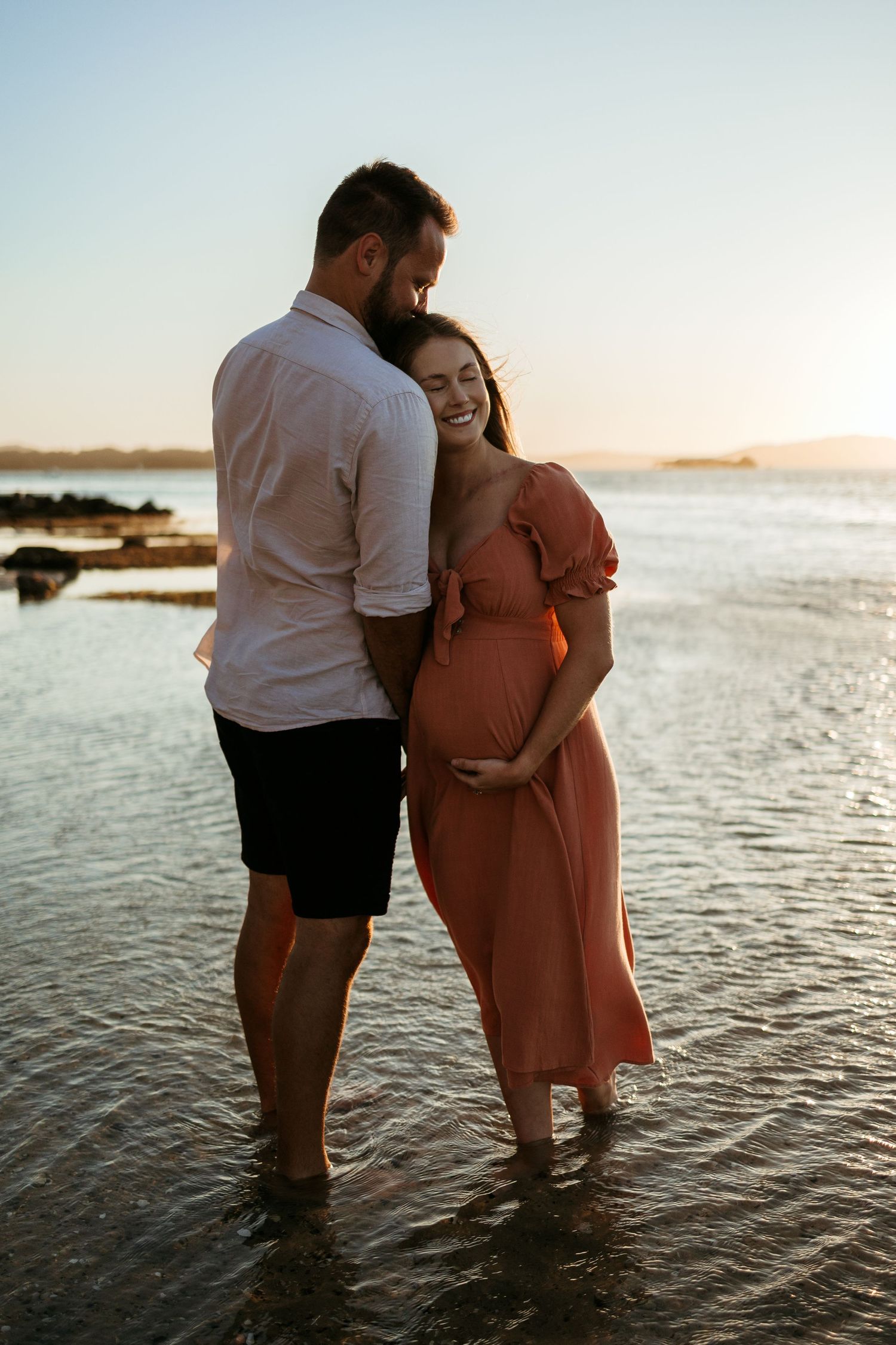 Couple love Maternity Photoshoot at sunset on the beach, Lake Macquarie, Newcastle, Hunter Valley, New South Wales