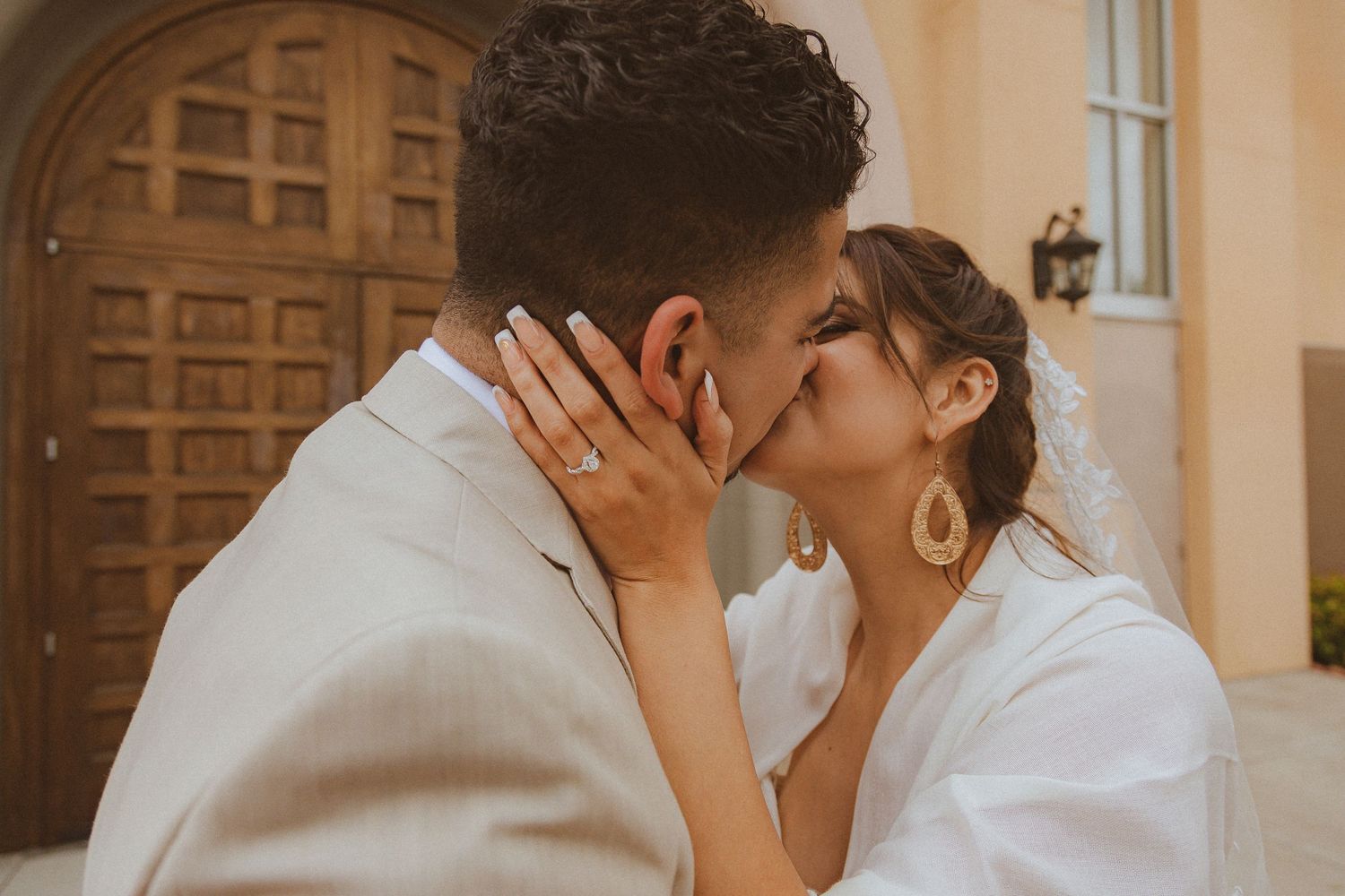 An intimate close-up of a couple sharing a tender moment during their wedding photoshoot.