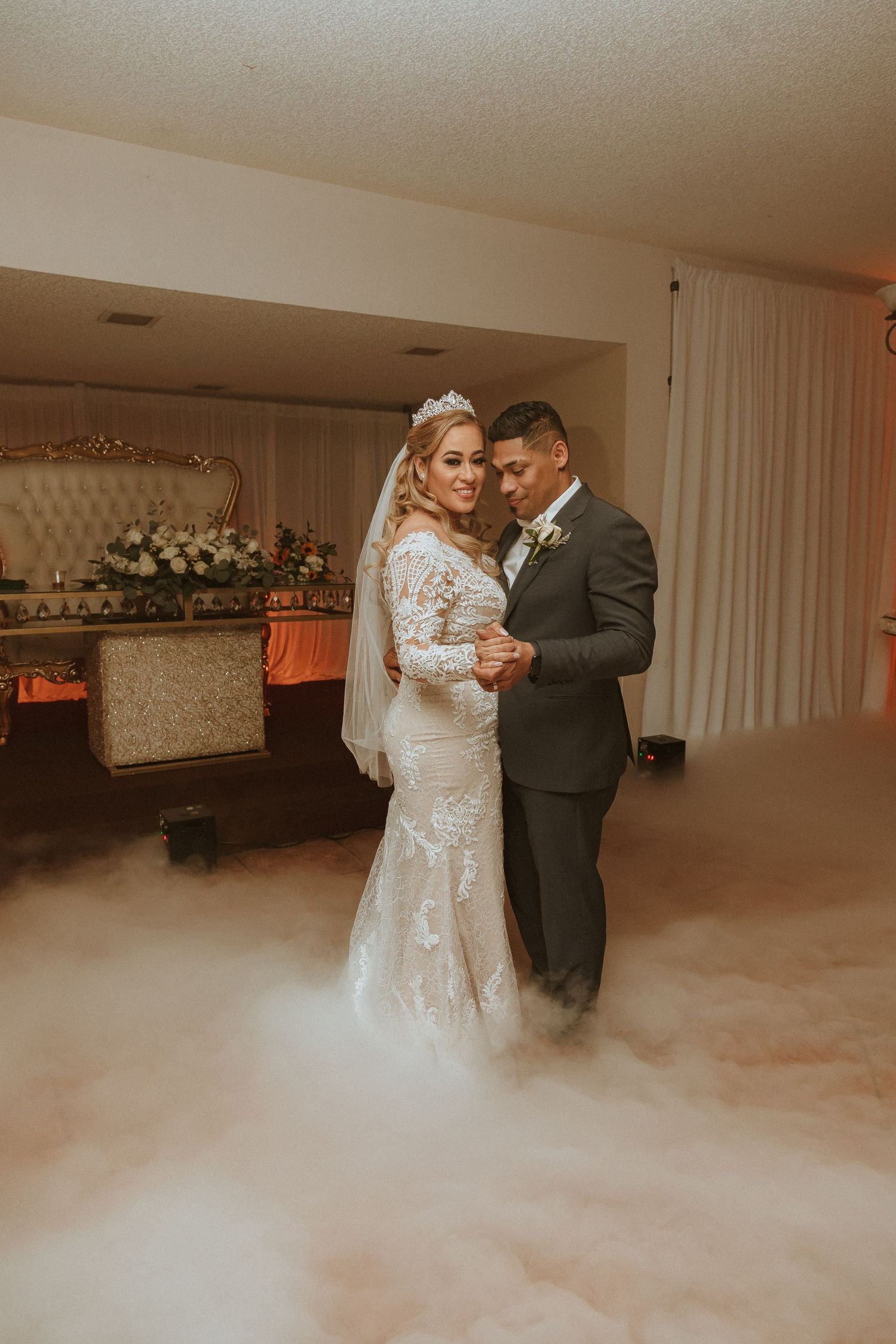 Elegant wedding dance scene with fog effects and vintage-inspired decor creating a romantic ambiance.