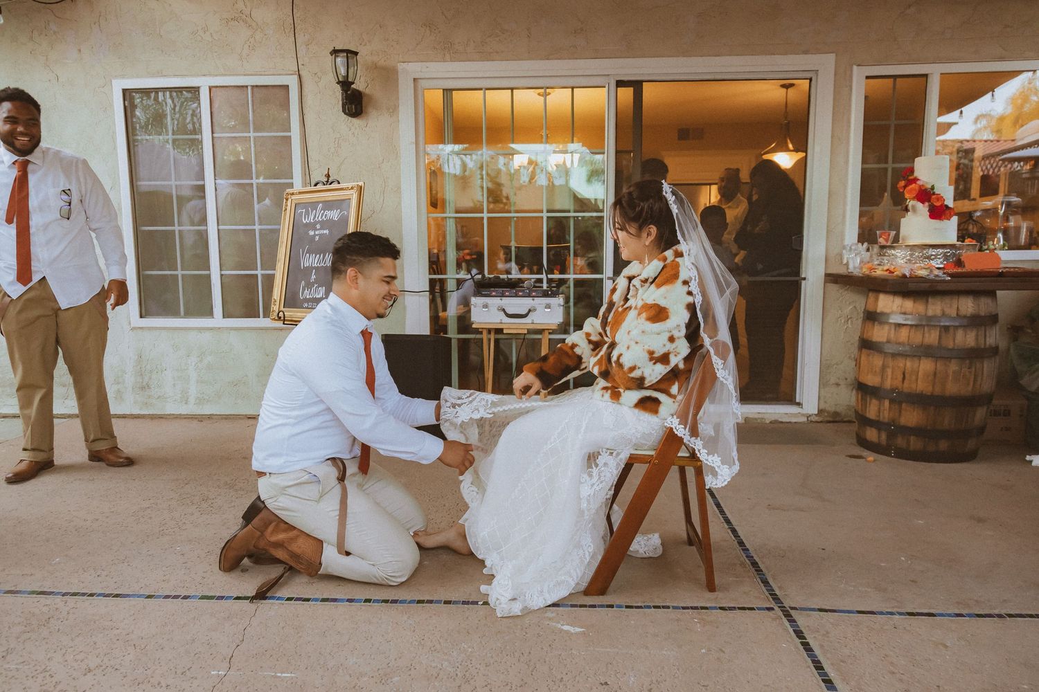 A tender moment shared between a couple during their outdoor wedding reception.