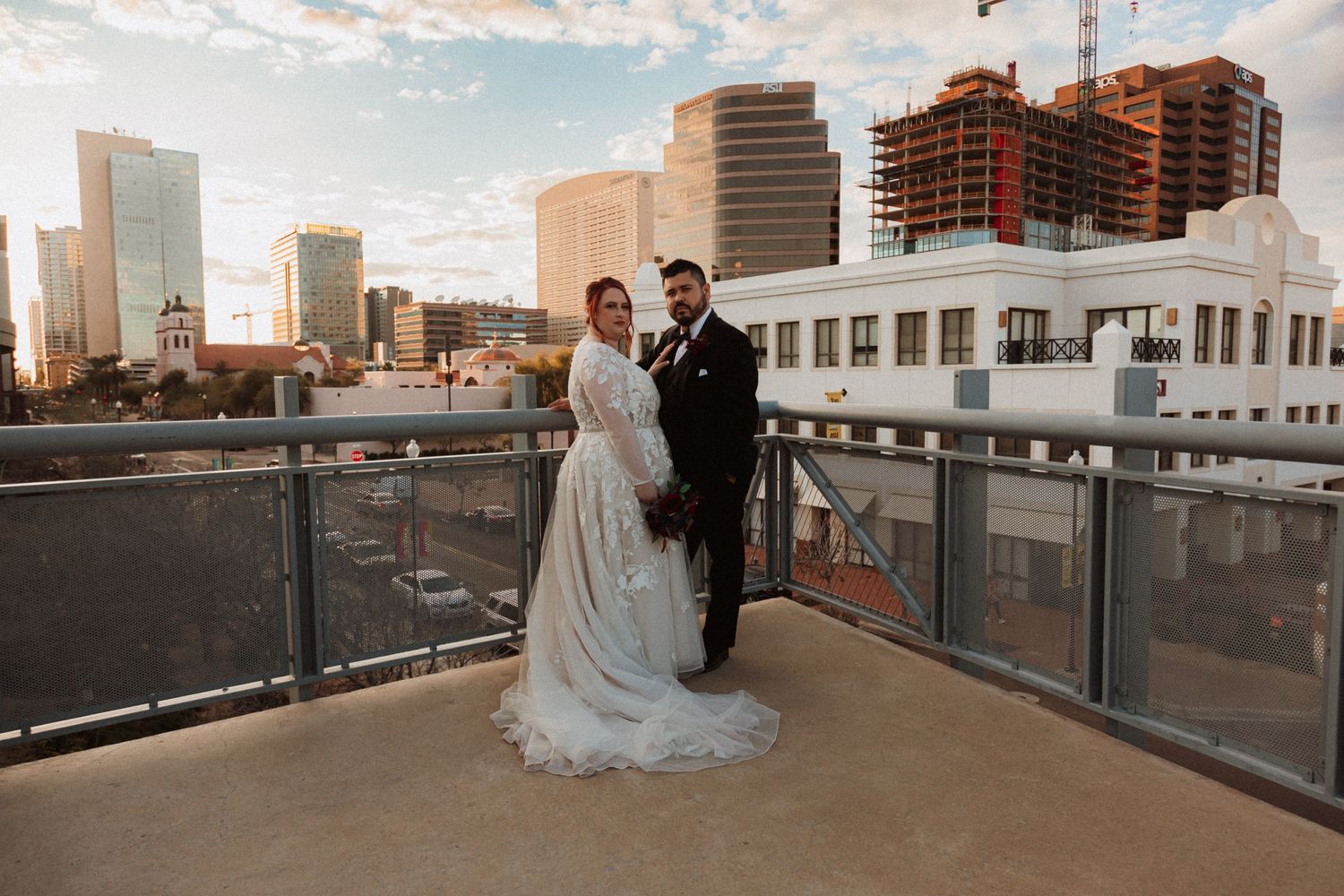 Golden hour wedding photography session on a downtown rooftop with urban skyline views.
