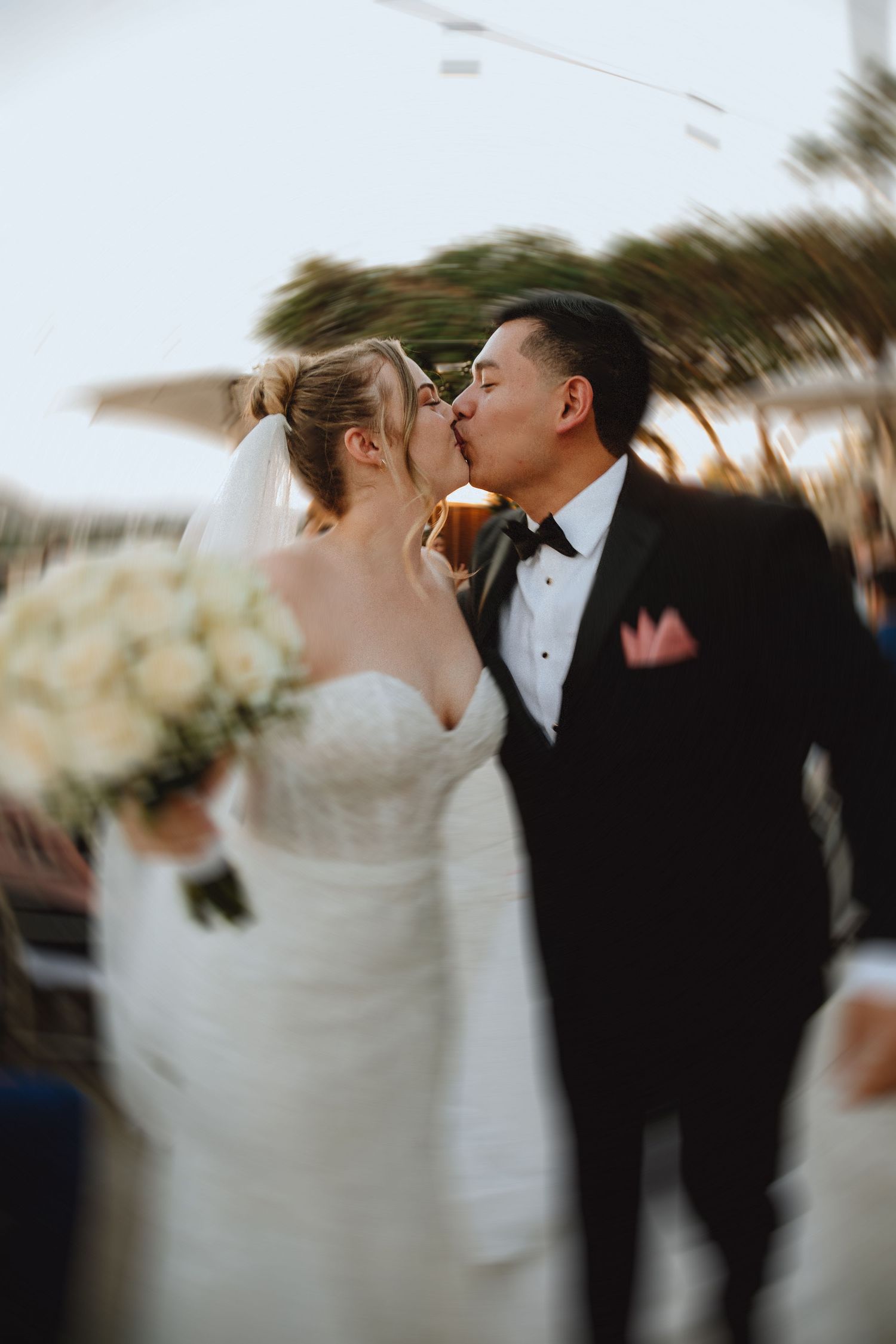 Intimate wedding moment captured during an outdoor celebration.