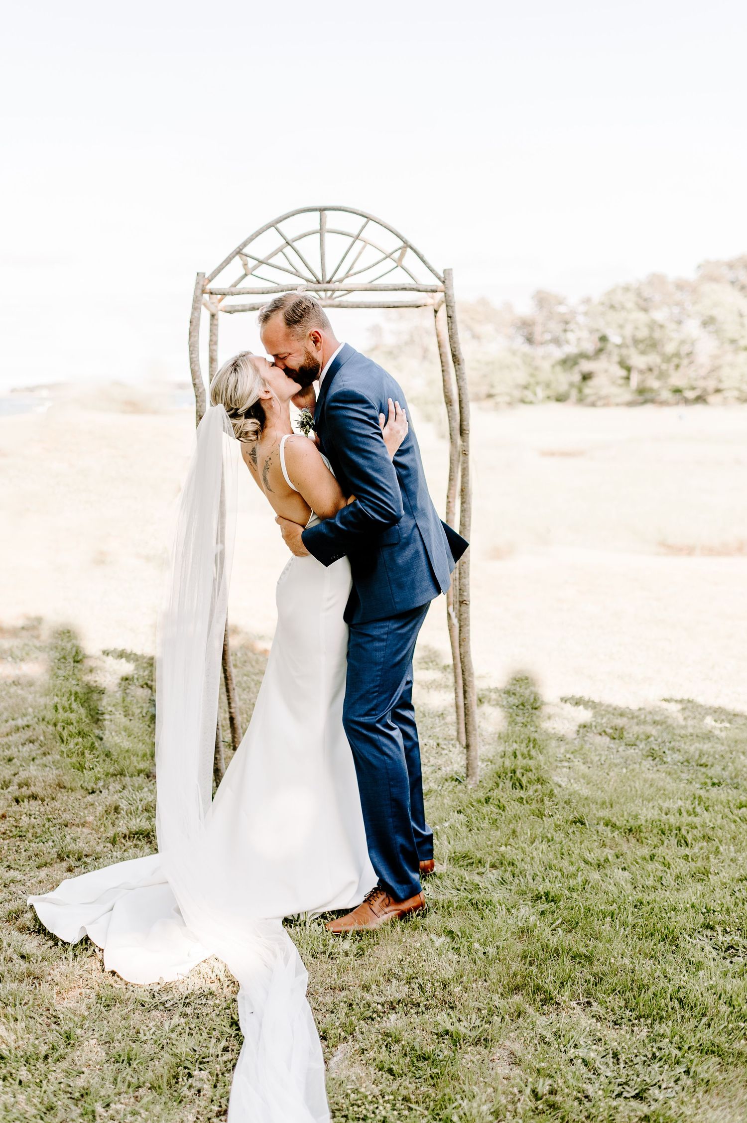 A series of intimate wedding ceremony moments captured on a grassy hillside.