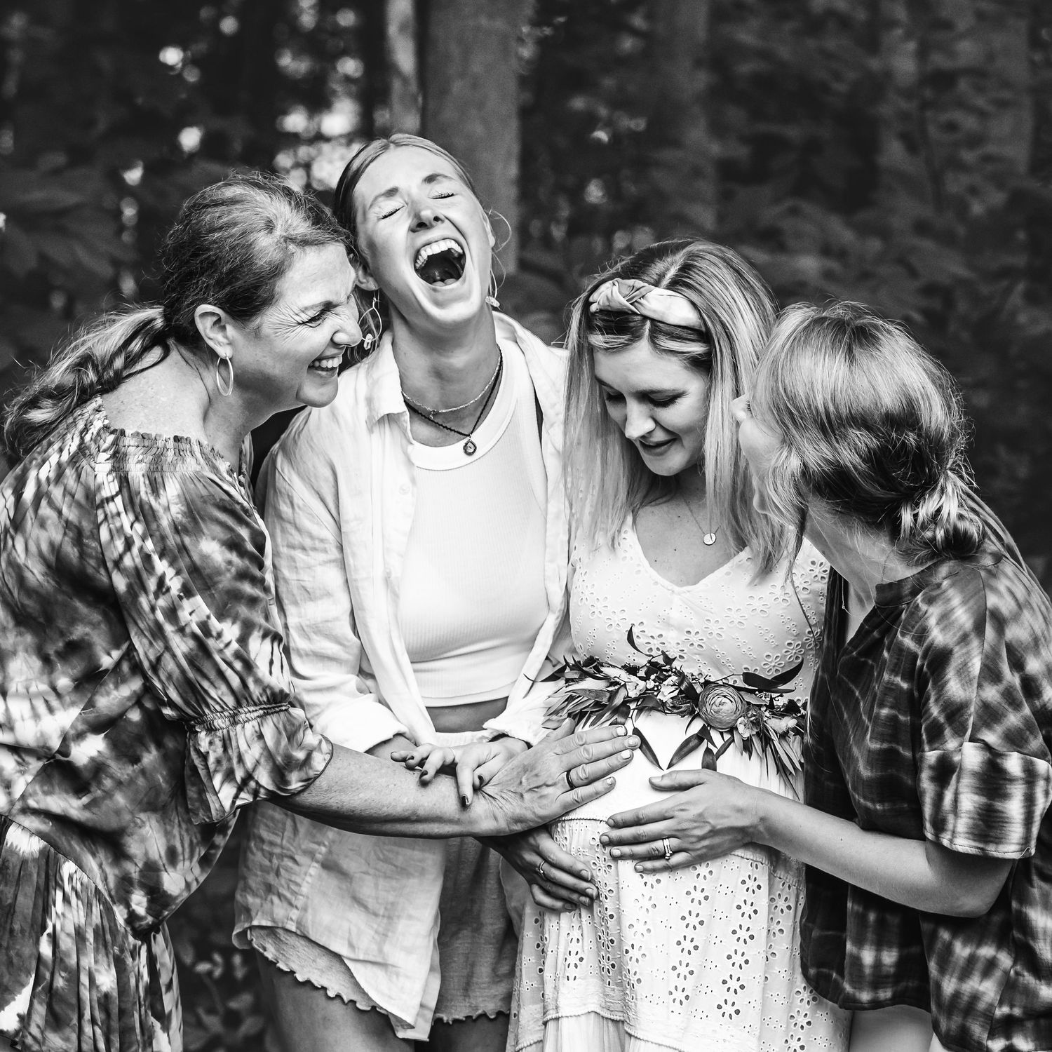 sisters at baby shower laughing