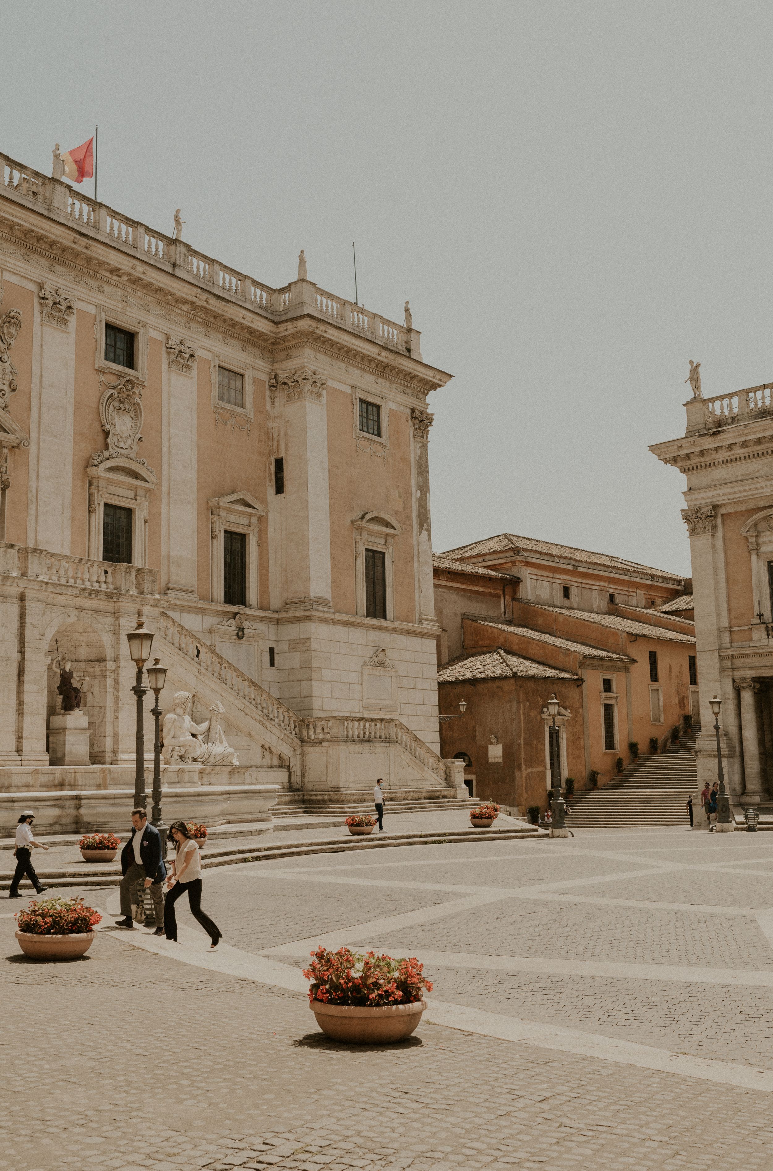 Historic government building in Rome with symmetrical stairs and classical architecture.