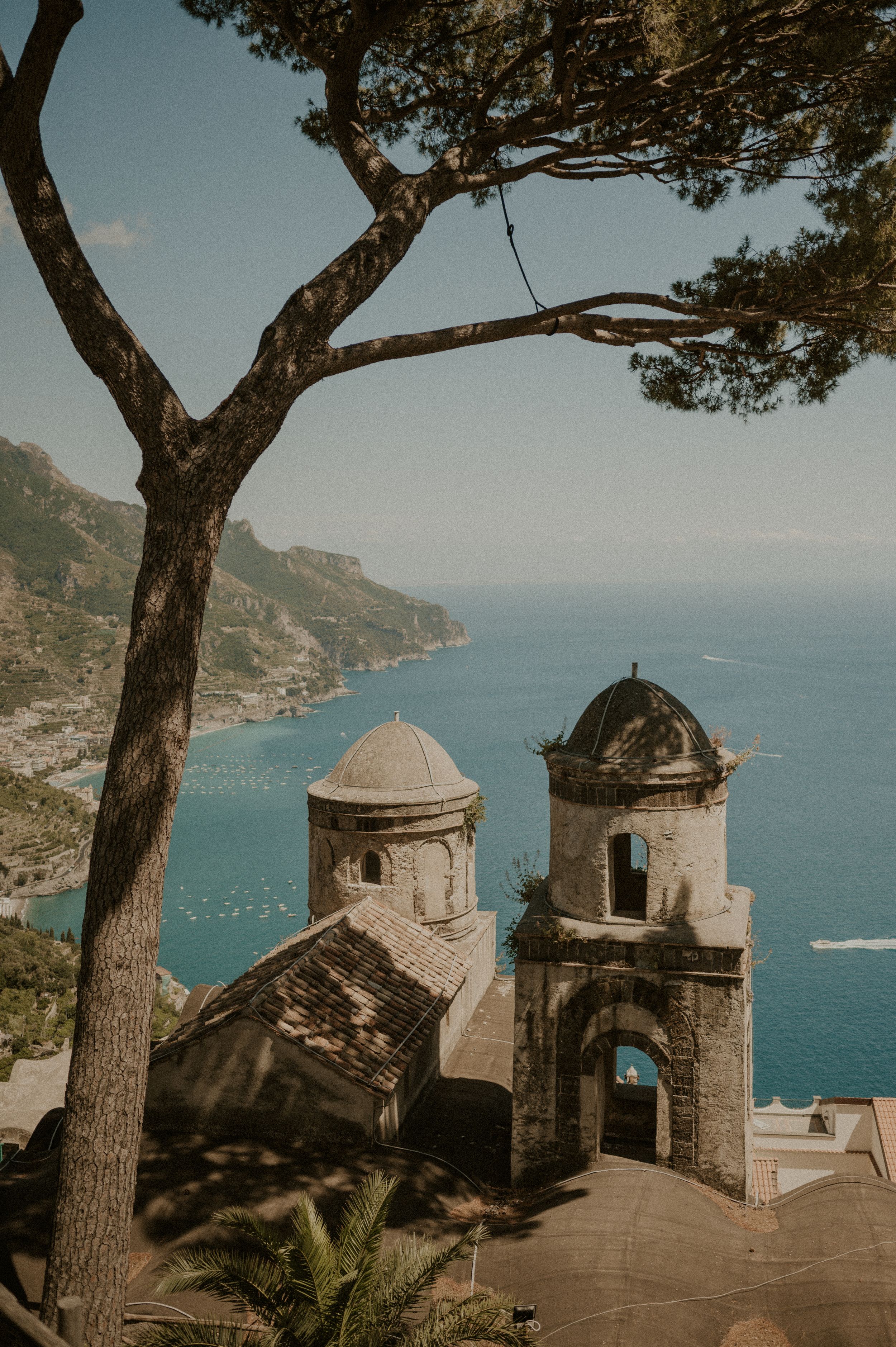 Twin bell towers of a historic church overlooking the Amalfi Coast.