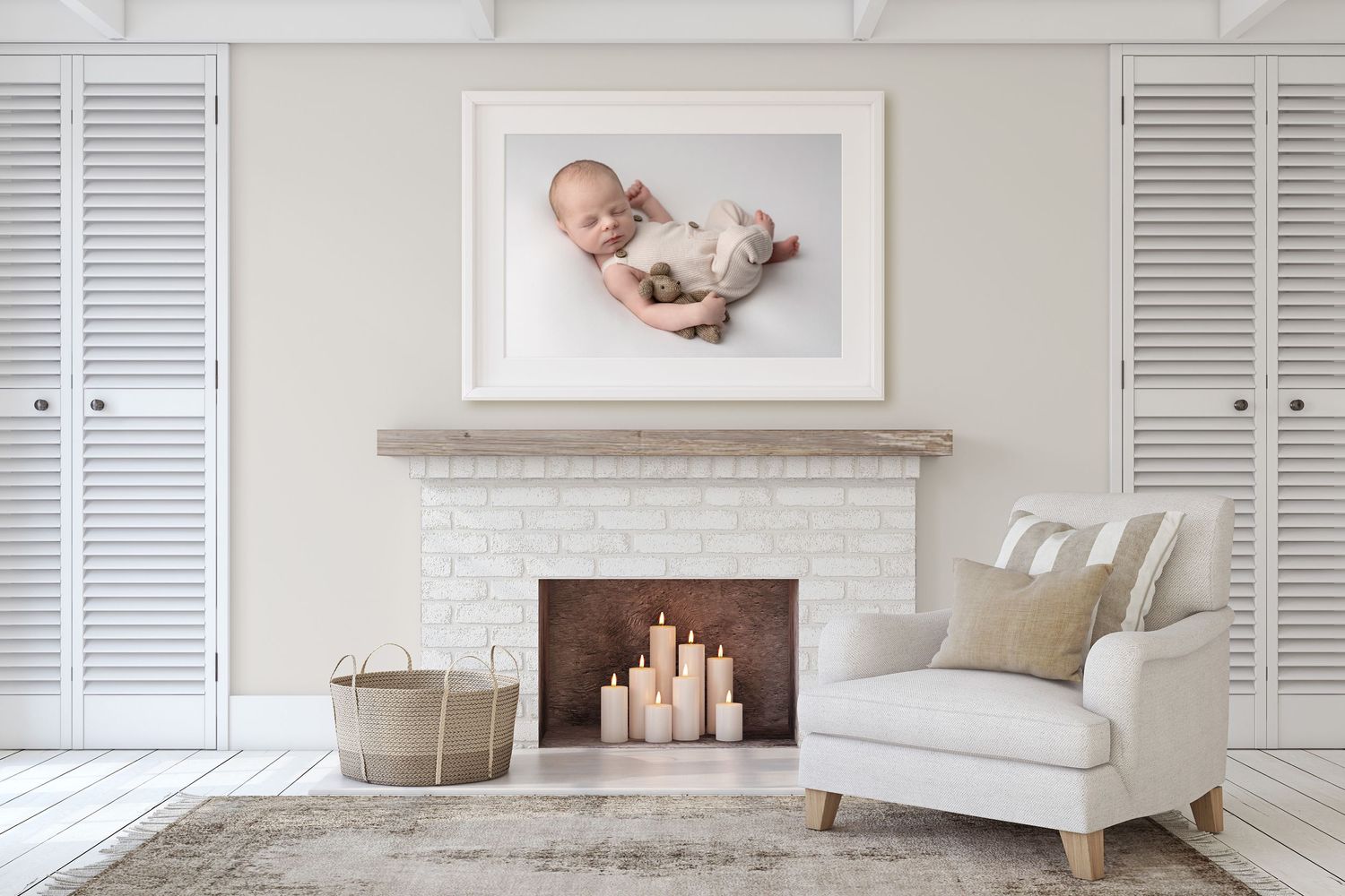 a newborn image framed on the wall of a lounge above a fireplace