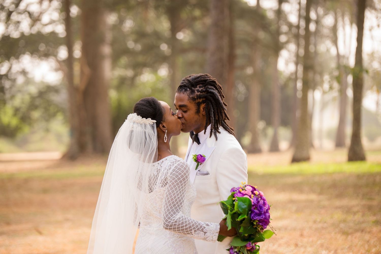 Nigerian outdoor white wedding portrait by JDFrank