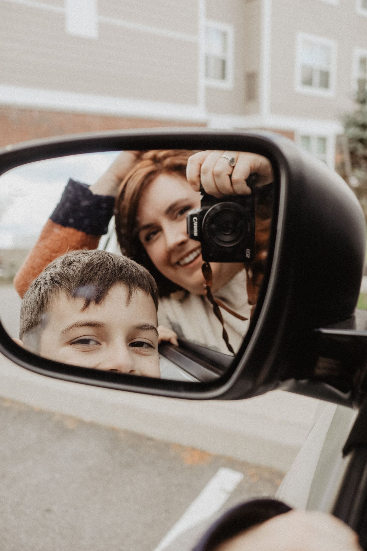 Creative car side mirror photography shot showing reflections.