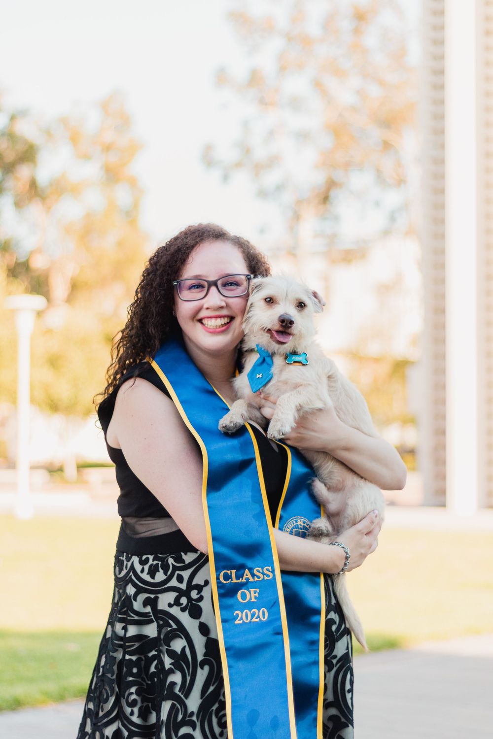 Professional college graduation portrait of a student celebrating commencement with natural lighting in Fresno, California