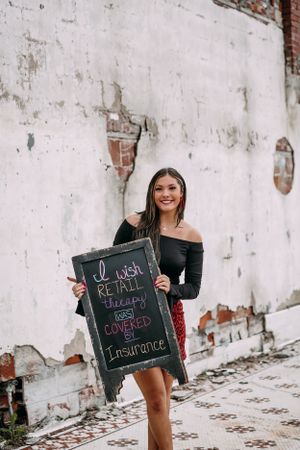 girl holding a sign