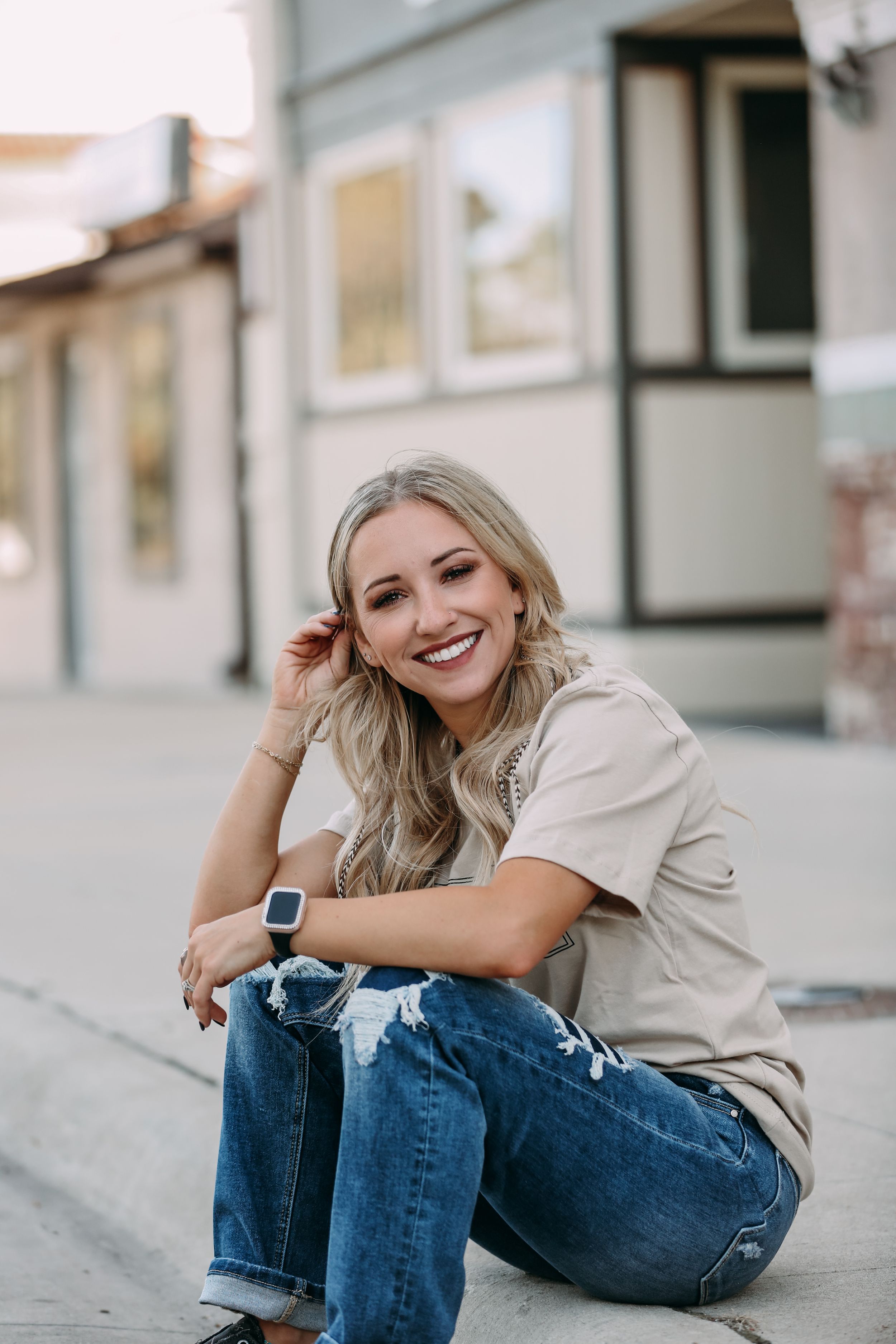 girl sitting on curb