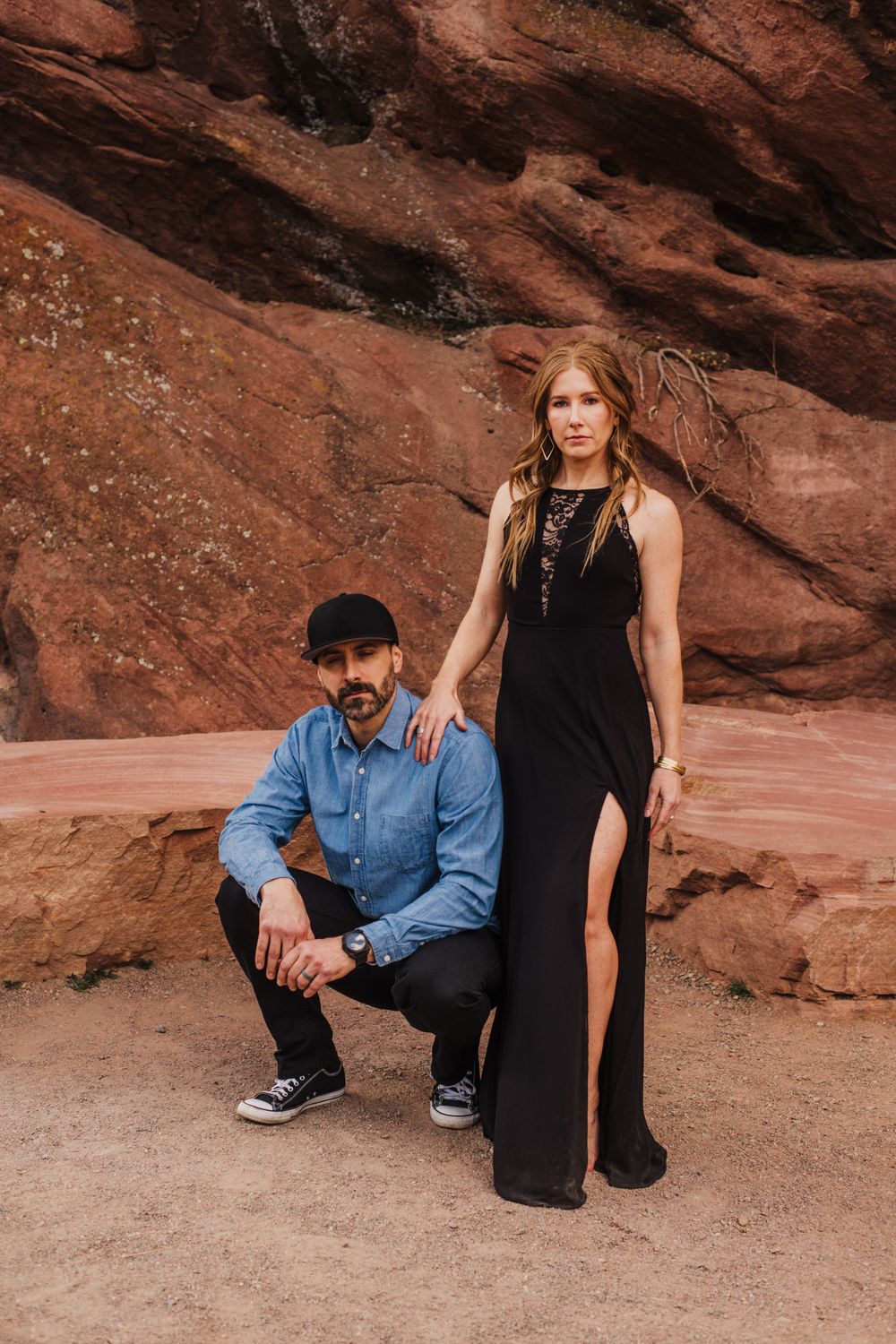 Stylish desert photo shoot featuring red rock formations and natural lighting.