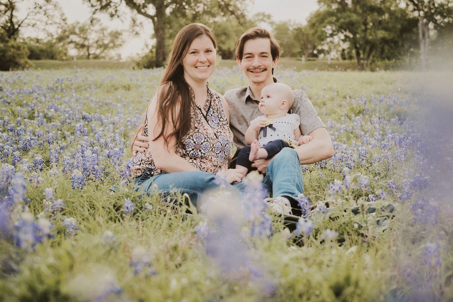 Family posing for family portrait bluebonnet session - San Marcos, TX