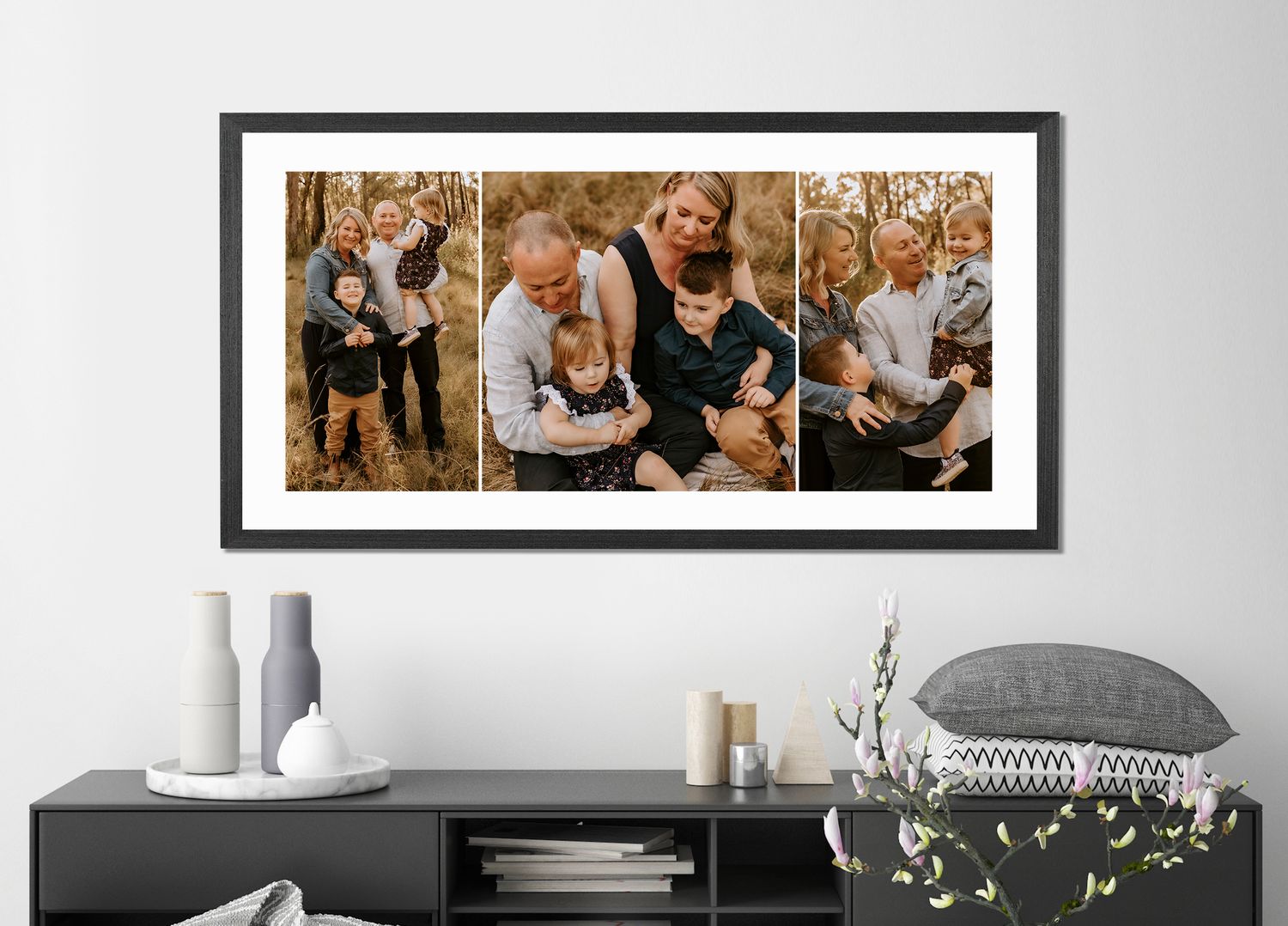 Modern gallery wall displaying framed family photo collections in contemporary white interior.