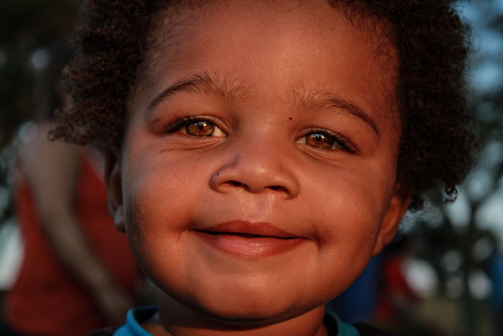 Close-up shots showing warm expressions and genuine smiles in natural lighting.