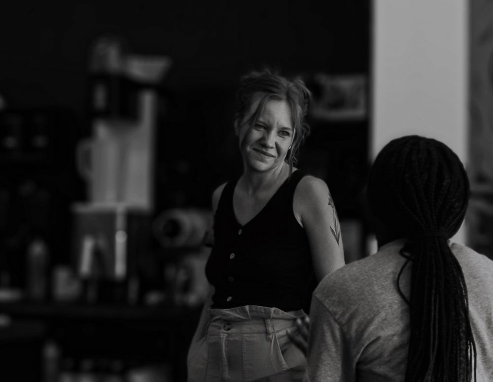 Dark moody interior shots capturing spontaneous moments and interactions.