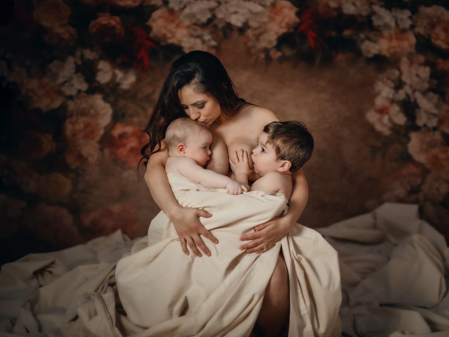 Mother with her two children in an intimate, artistic motherhood portrait. Toronto motherhood photography.