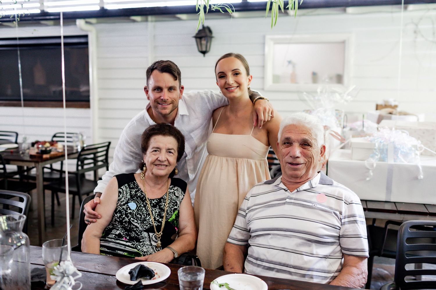 Family members sharing a special moment together at a celebration dinner.