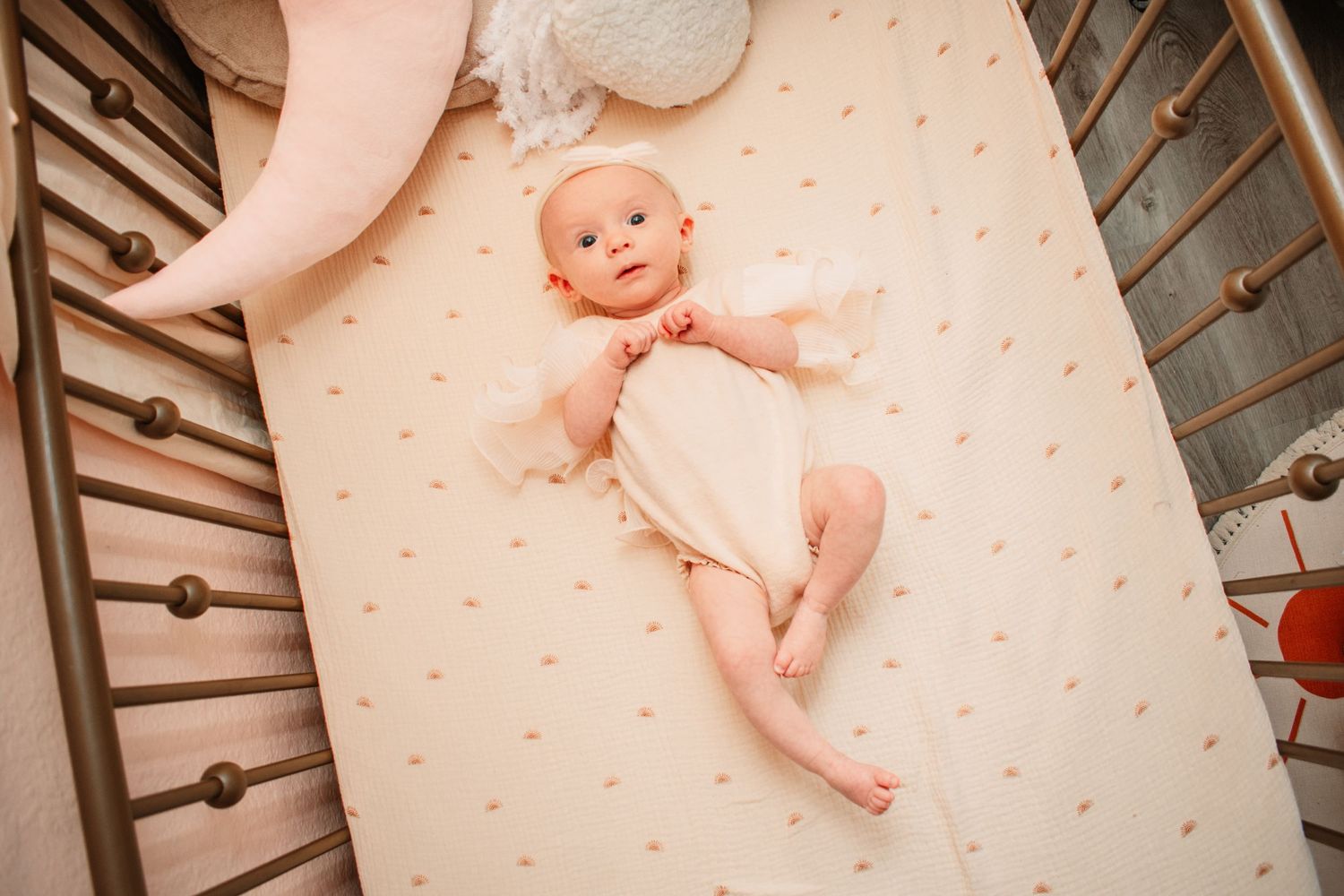 Natural light newborn portrait with relaxed, unposed styling.