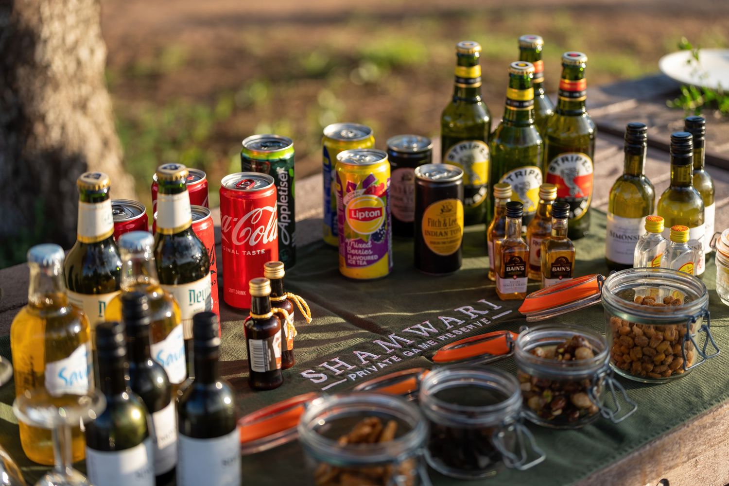 Collection of assorted condiments and spices arranged on a wooden surface.